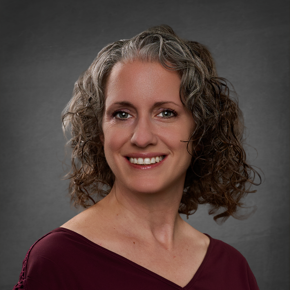 Headshot of Deb Marinovic smiling.