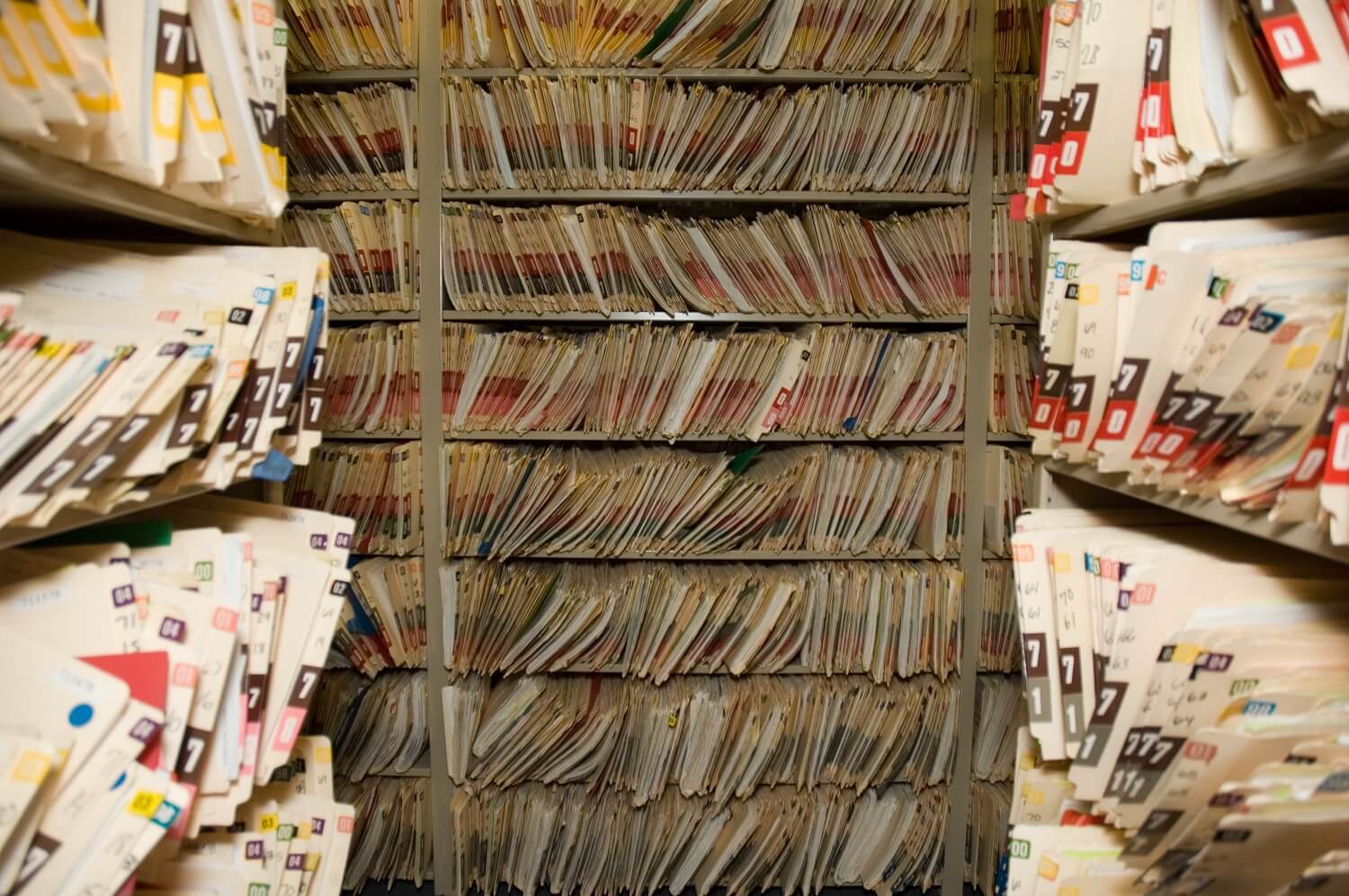 A room of shelves full of medical records.